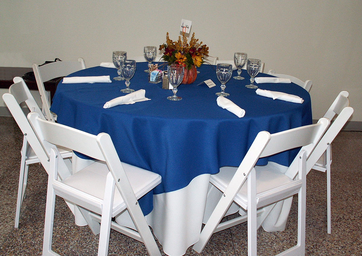 72x72 Royal Blue Solid Tablecover Topper On Top of 120" Round White Solid Tablecover On A 60" Round Table